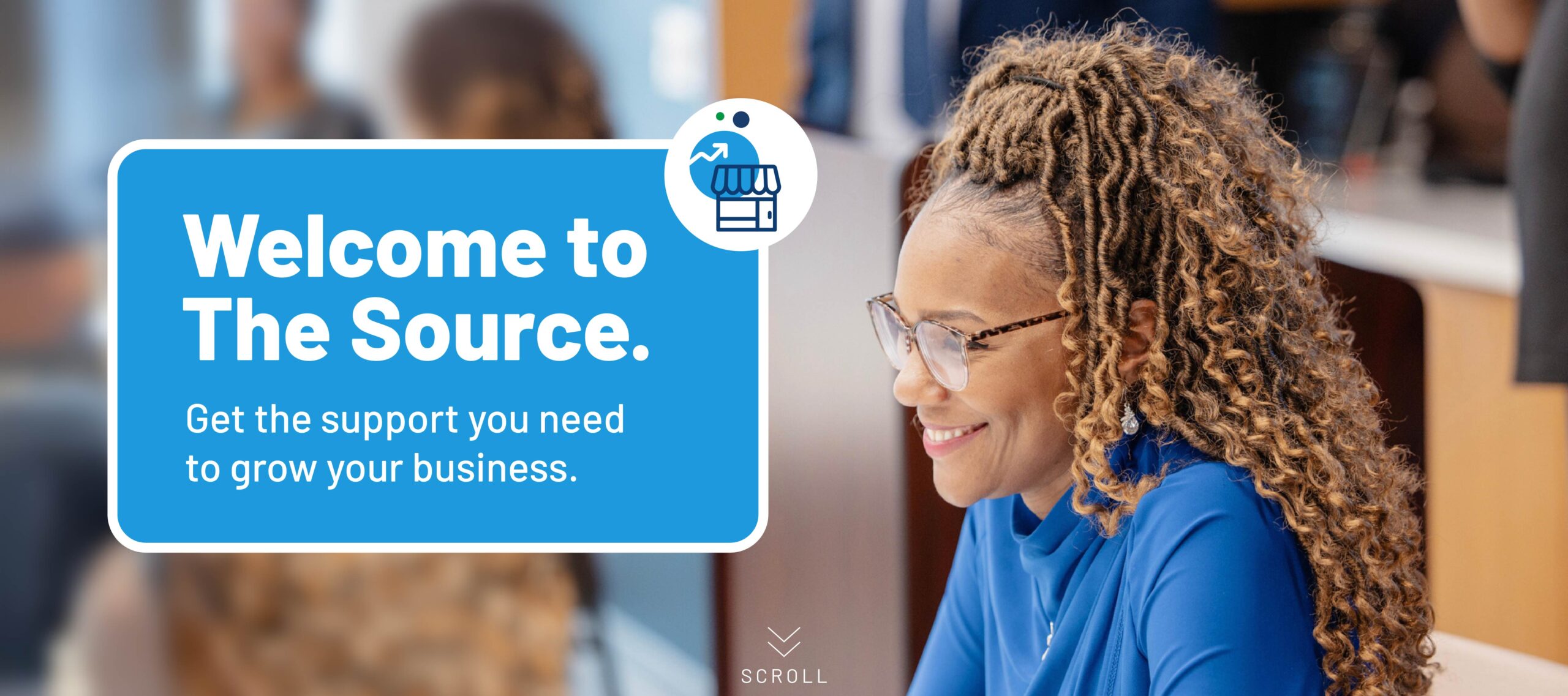 A smiling woman with braided hair and glasses sits at a desk, exuding confidence in an office environment. To her left, overlay text reads, Welcome to The Source. Get the support you need from Cook County Small Business Source to grow your business, highlighting resources available for entrepreneurs. The background is softly blurred, suggesting a professional atmosphere focused on aiding small businesses in Cook County.